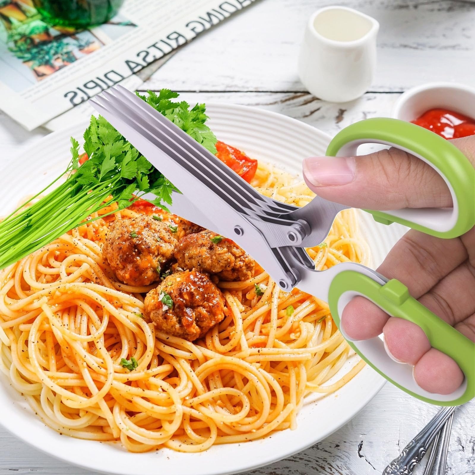 Herb scissors cutting fresh parsley over pasta
