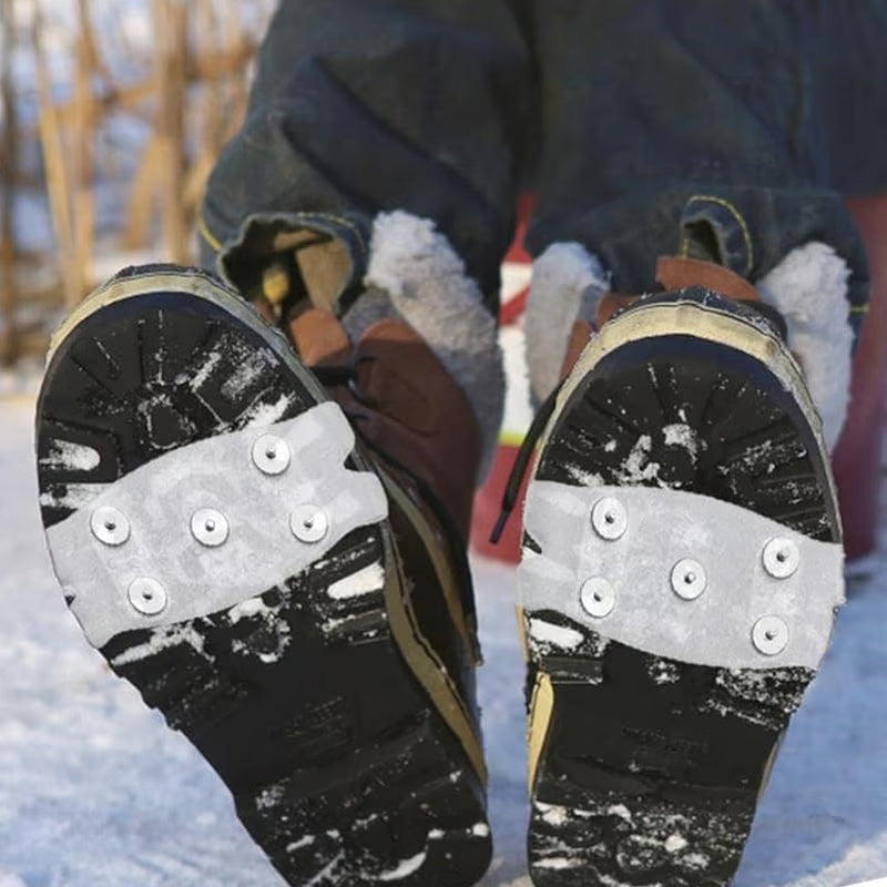 Close-up of metal studs on both winter shoe grip covers